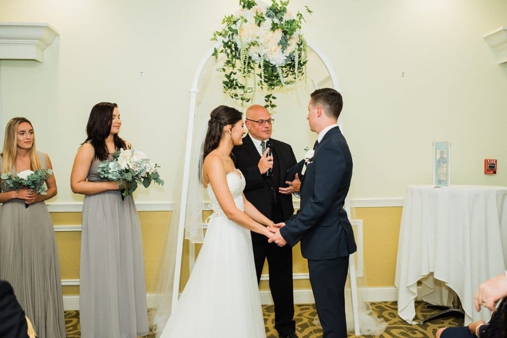 Pastor-Mike-Weddings-Bride and Groom saying vows during ceremony indoor chapel.