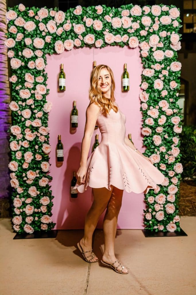 Orlando-Flower-Walls-Pink and green floral wall with champagne bottles