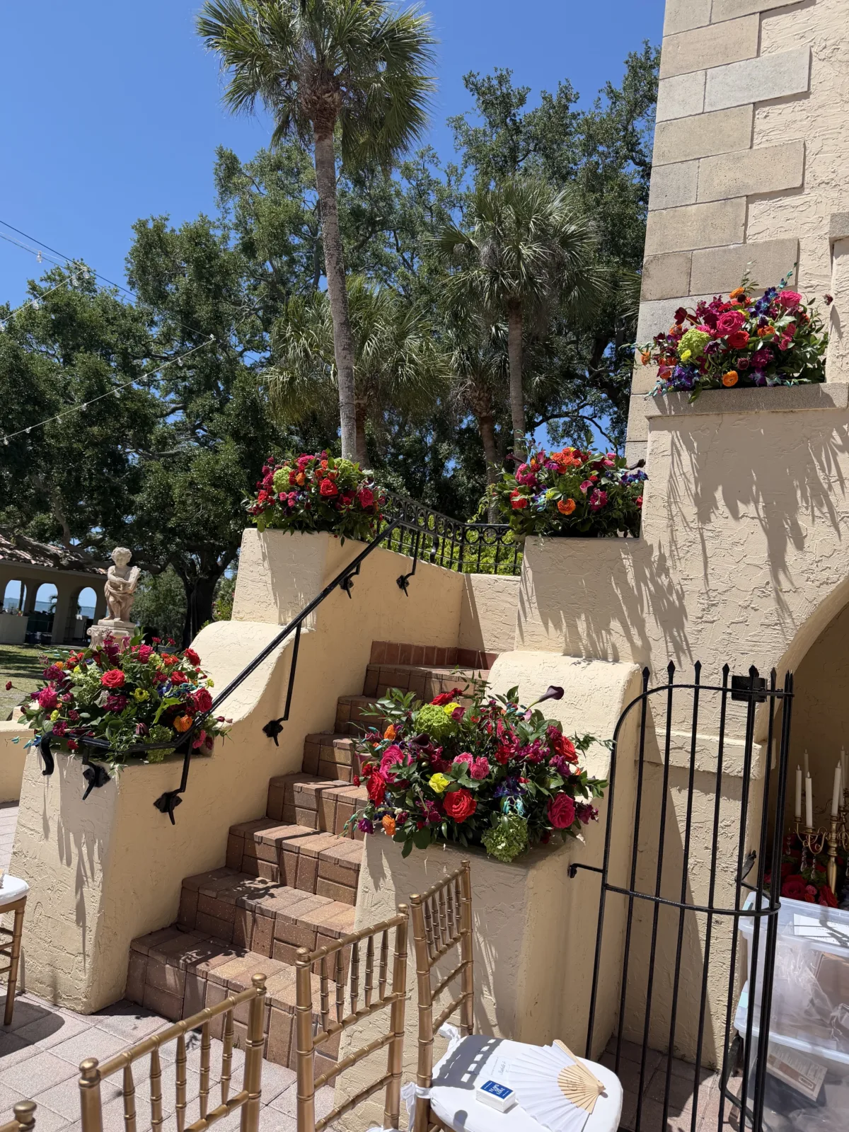 stone staircase with colorful bouquets for tropical florida wedding