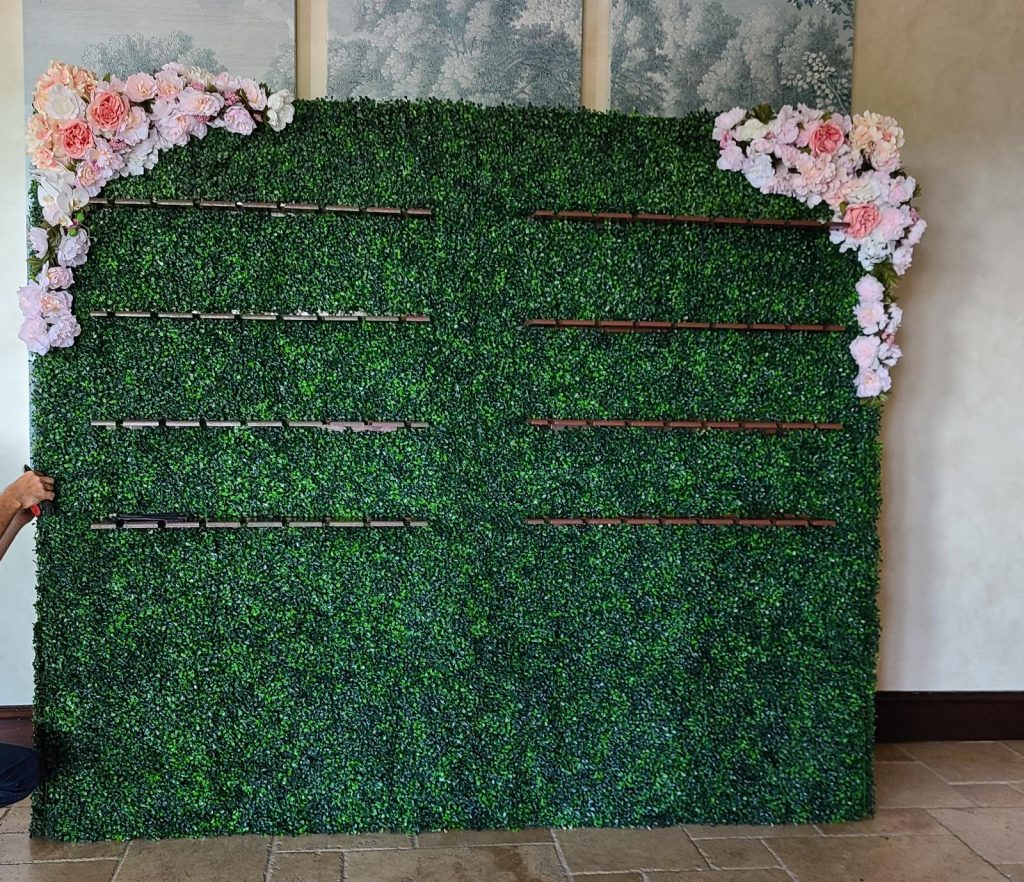 green flower wall with shelves