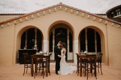 bride and groom dancing between tables at 1885 Events at Rollins College