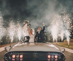 couple in a vintage car with fireworks