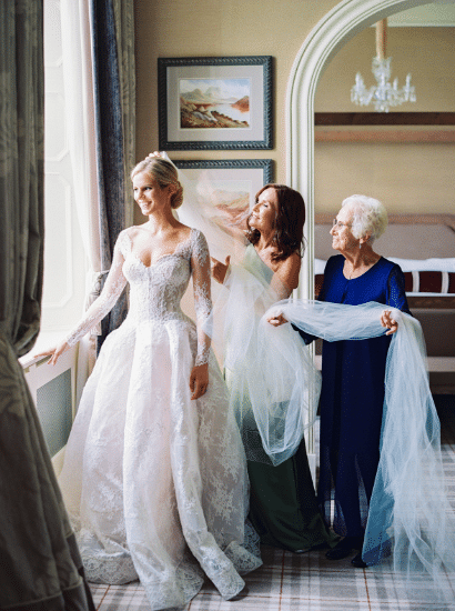 bride customize your wedding dress with mother & grandmother holding veil