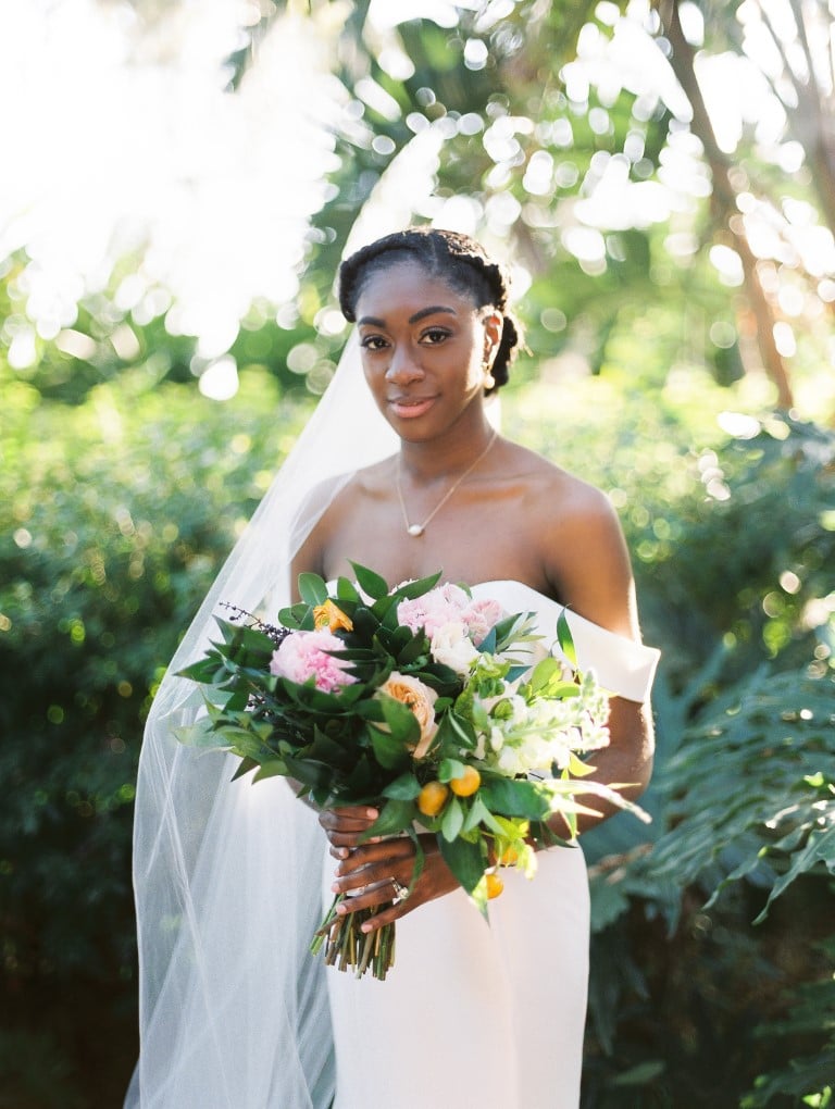 bride with bouquet of greenery and pink flowers
