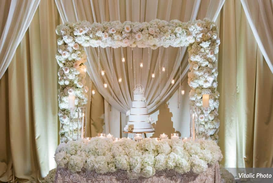 Fairbanks Florist - white flower in a square shape around wedding cake