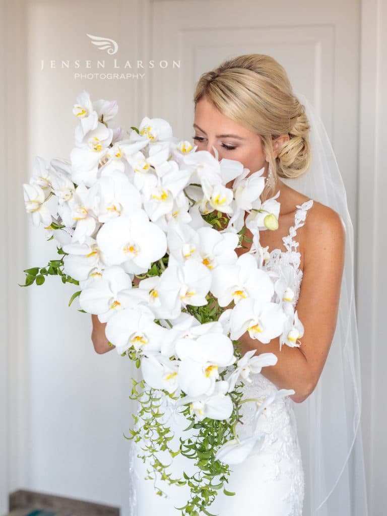 Fairbanks Florist- bride holding a large white bouquet
