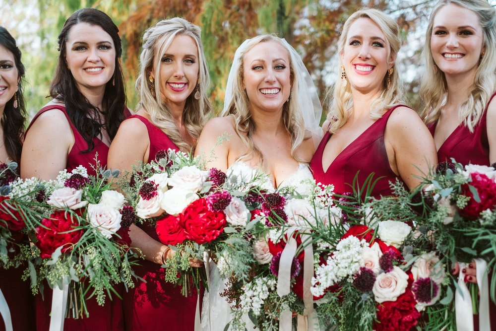 Fairbanks Florist - bride with bridal party with red and white flowers