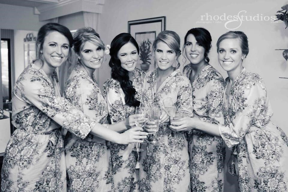 black and white photo of weddig party in floral silk robes and hair and makeup done by Jazz It Up Artistry