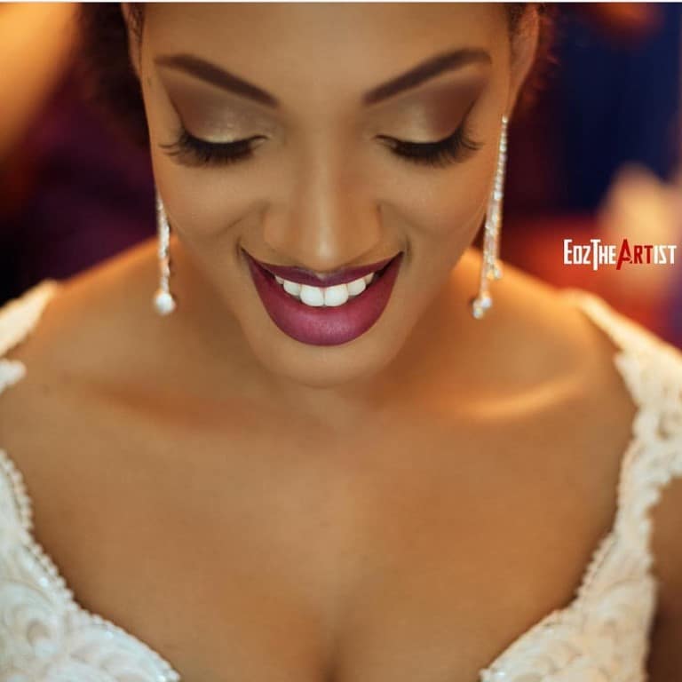 bride looking down showing her eye and lip make-up styled by Jazz It Up Artistry