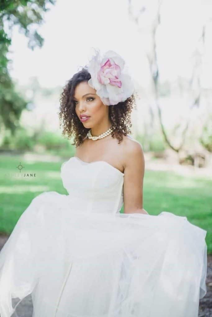 bride with pink peony headband and hair and makeup styled by Jazz It Up Artistry