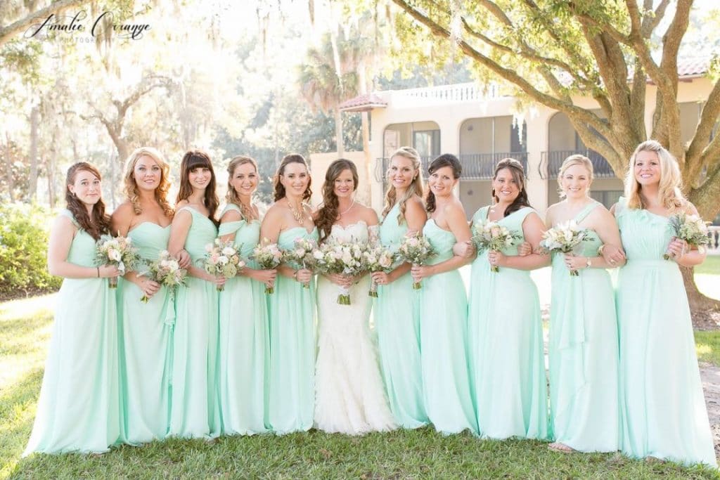 styling by Jazz It Up Artistry of bride and all of her mint wearing bridesmaids under a canopy of oak trees