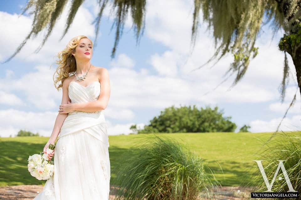 bride outdoors with hair flowing in the wind styling by Jazz It Up Artistry