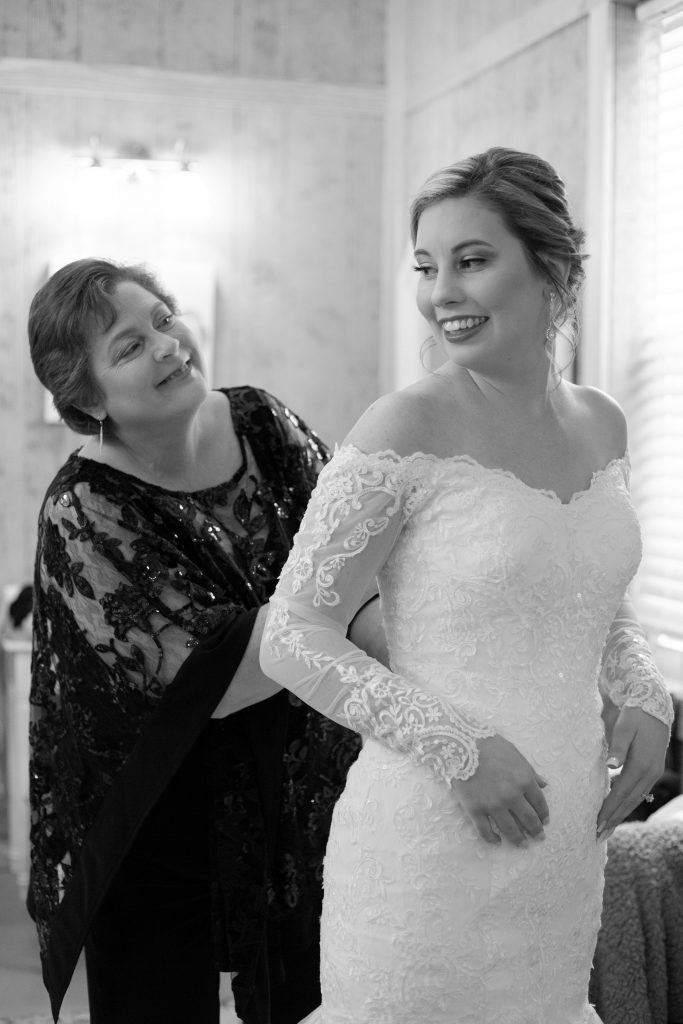 Natural Flash Photography - black & white photo of bride getting ready with mother