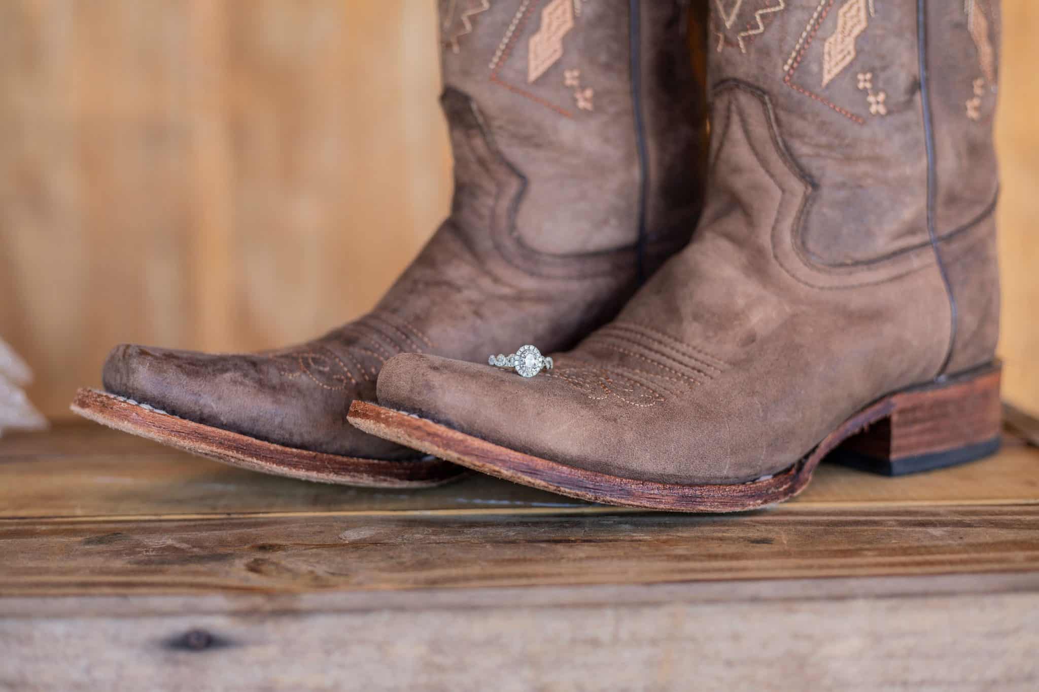 Cowboy boots with diamond rind sitting on top