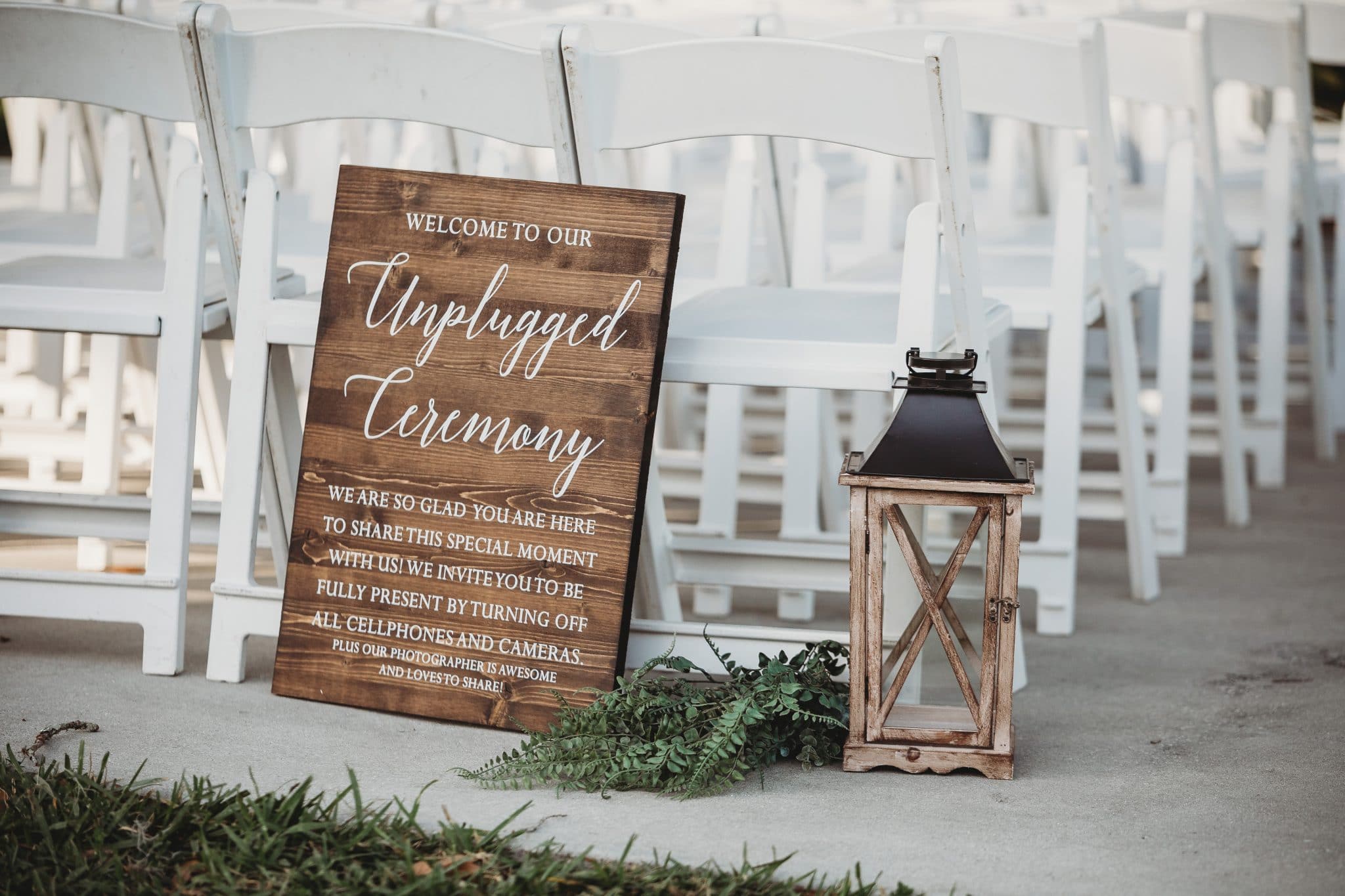 Rachel Doyle Photography - Wood Unplugged Ceremony sign at outside wedding