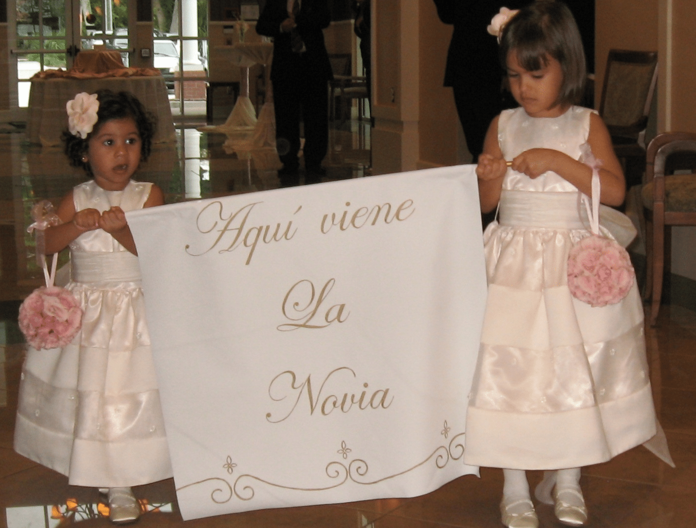 custom wedding sign - two flower girls holding a custom painted sign