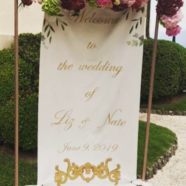 custom wedding sign- hand painted welcome sign hanging outside the ceremony