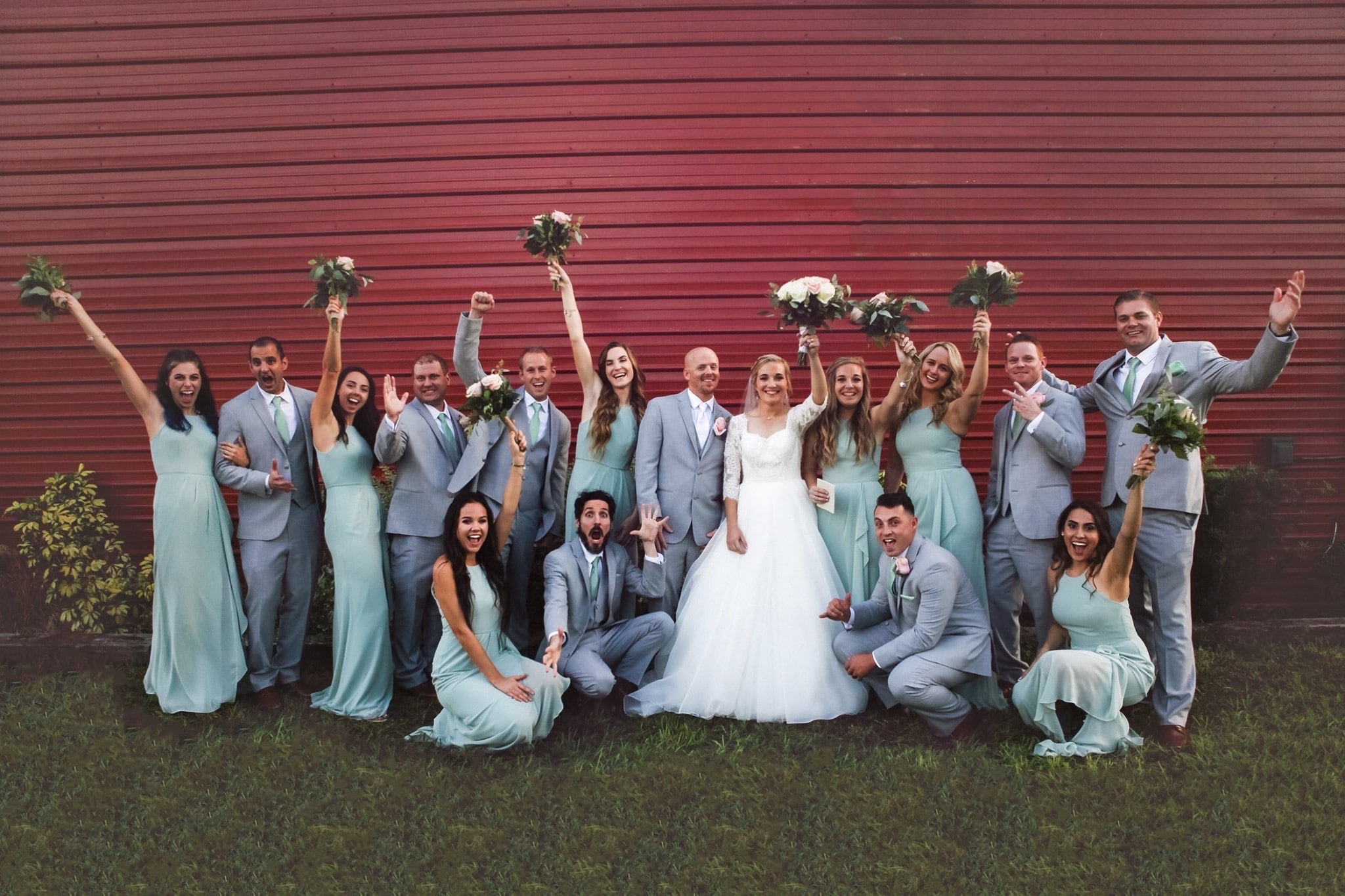 Diamond L Venue - wedding party posing outside red barn
