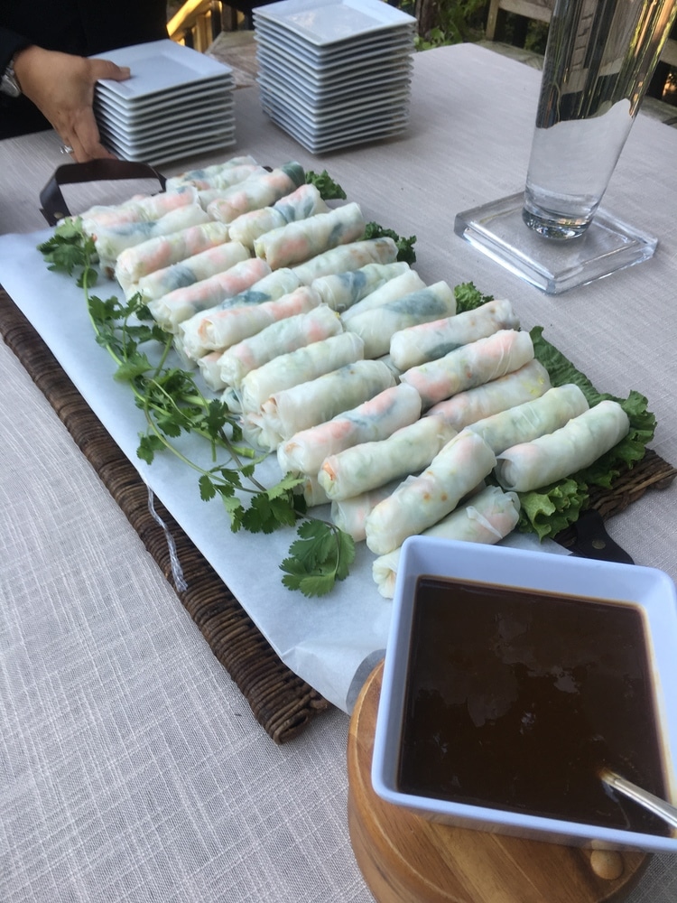 summer rolls set out at wedding buffet with peanut dipping sauce by Foodie Catering