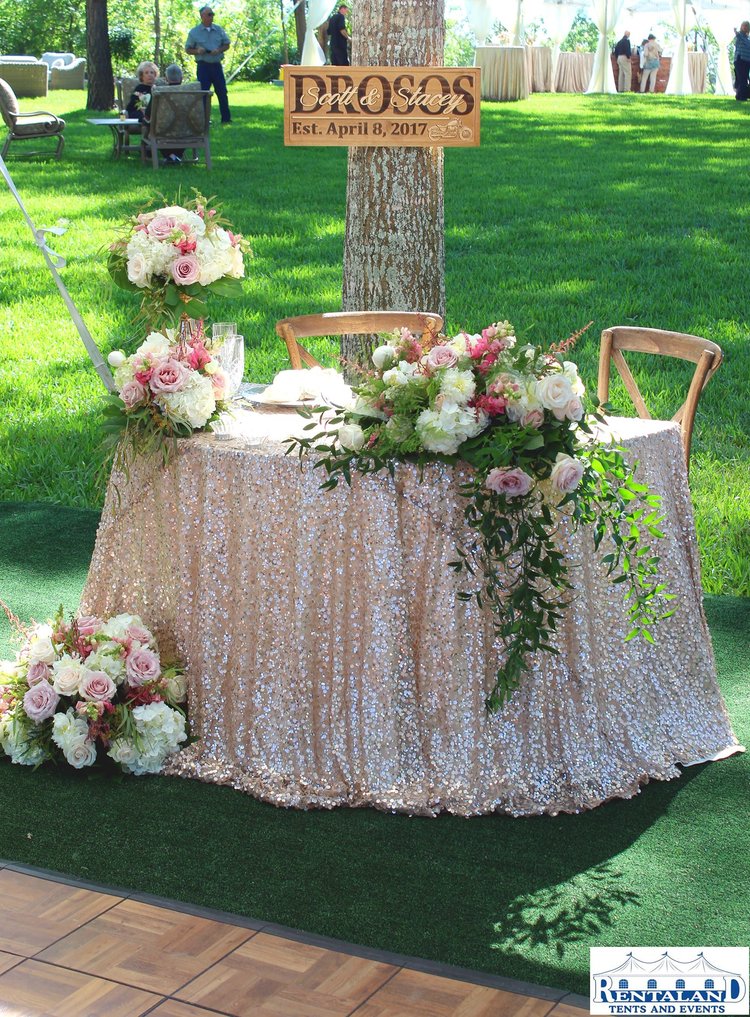 sweetheart table at an outdoor wedding reception set by Foodie Catering