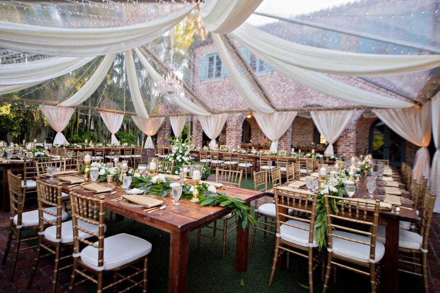 Arthur's Creative Events and Catering - tables prepared under a canopy of silk streamers