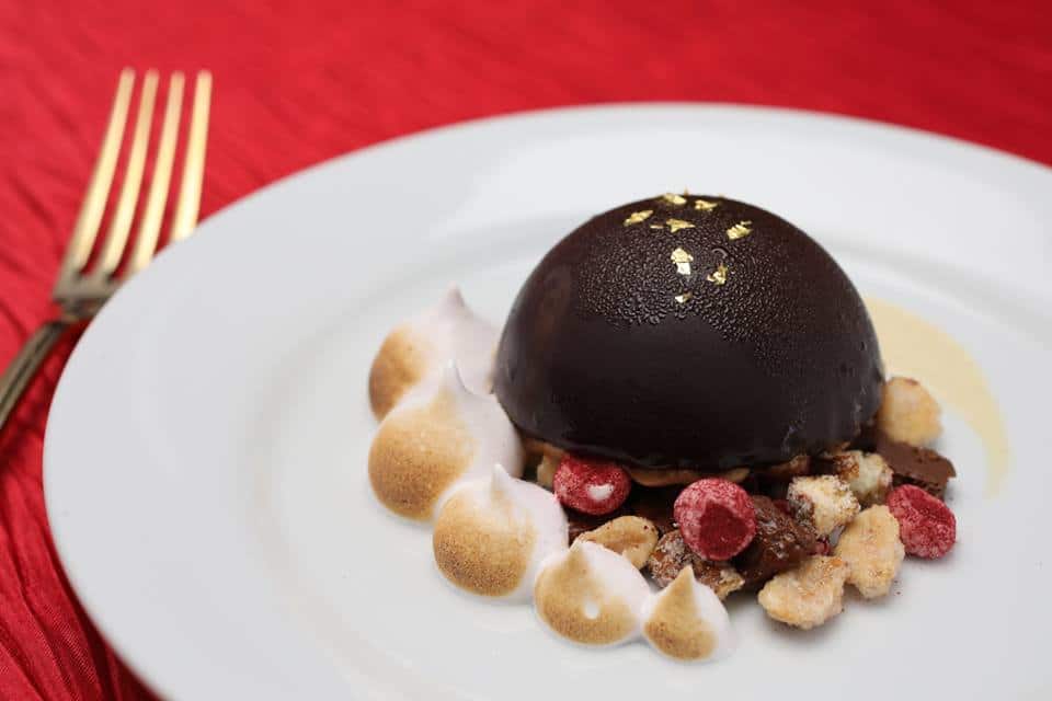 Arthur's Creative Events and Catering - closeup of a plated malted chocolate bombe