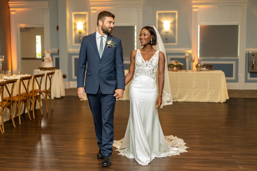 Barney E. Veal Center bride and groom walking into wedding reception