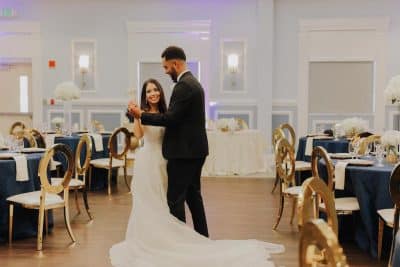 Barney E. Veal Center featured image _ bride and groom standing in reception room