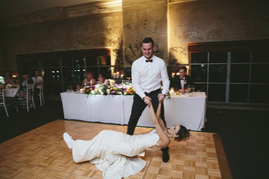 Groom dipping bride on dance floor