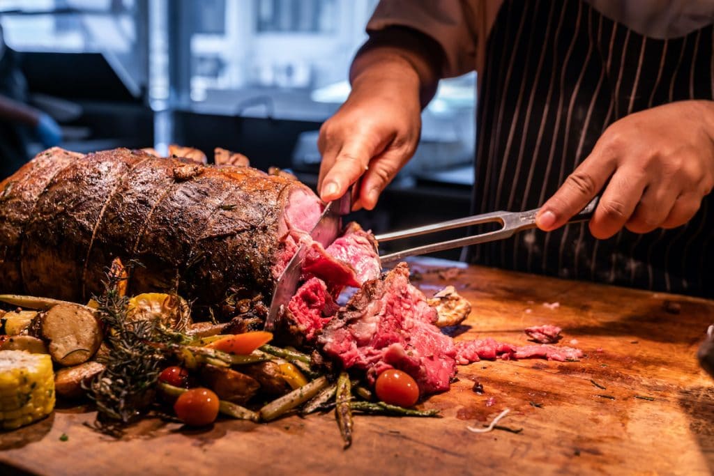 Premiere Event Services cutting wagyu beef roast prime rib