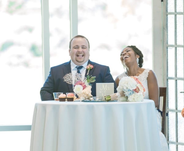 Unique Elements - Bride and groom laughing at table