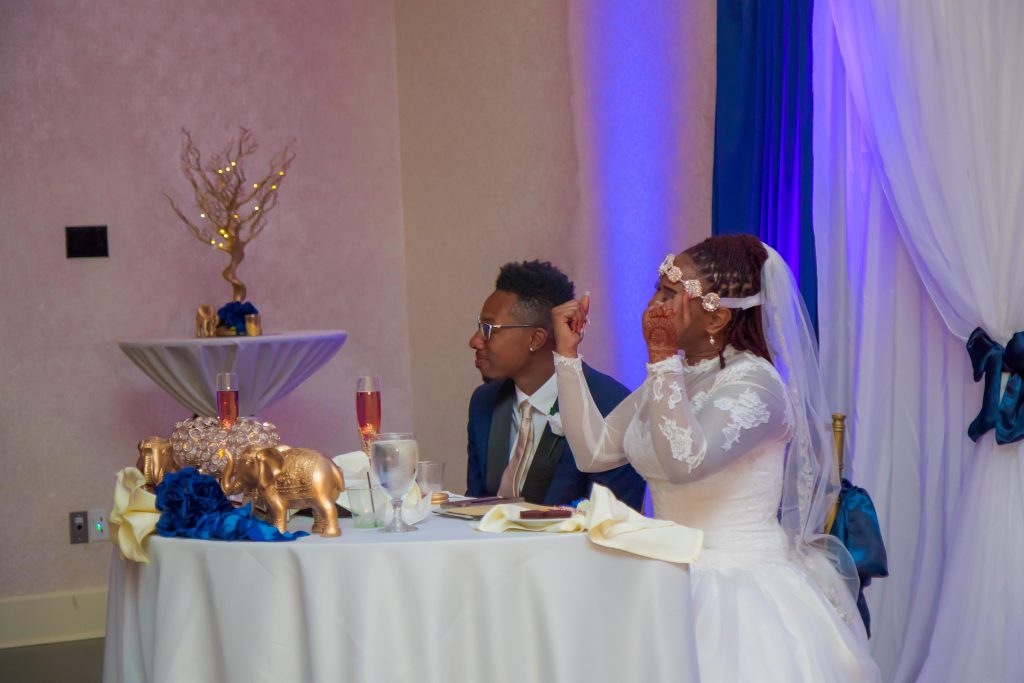 Unique Elements - Bride and groom at head table during reception