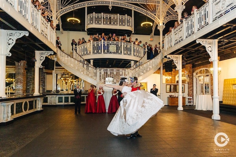 Complete Weddings + Events bride and groom dancing in giant ballroom