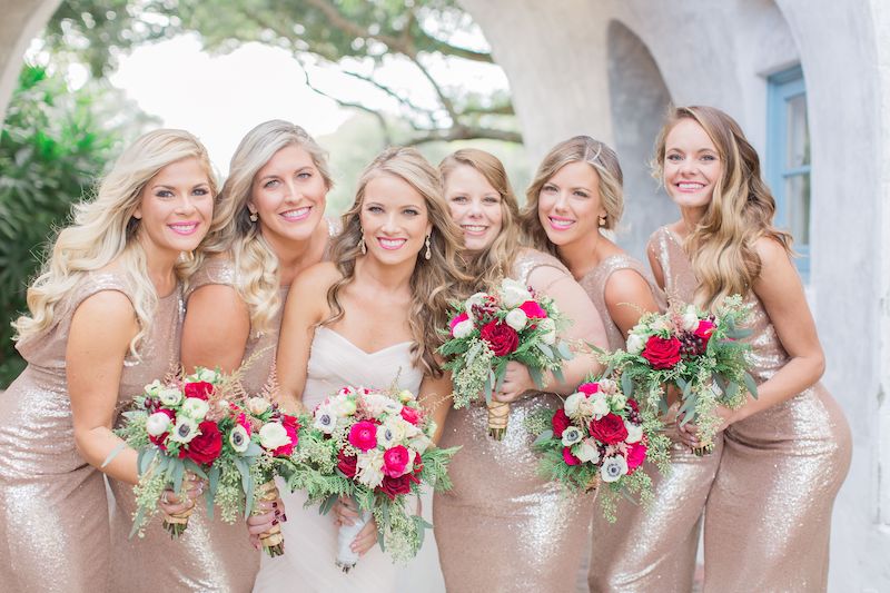Lowe and Behold bride and her bridesmaids holding their matching flower bouquets