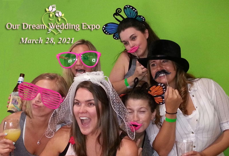 woman having fun with the photo booth at the Our Dream Wedding Expo