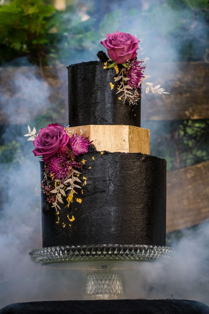 Gothic Victorian Wedding black & gold cake with flowers