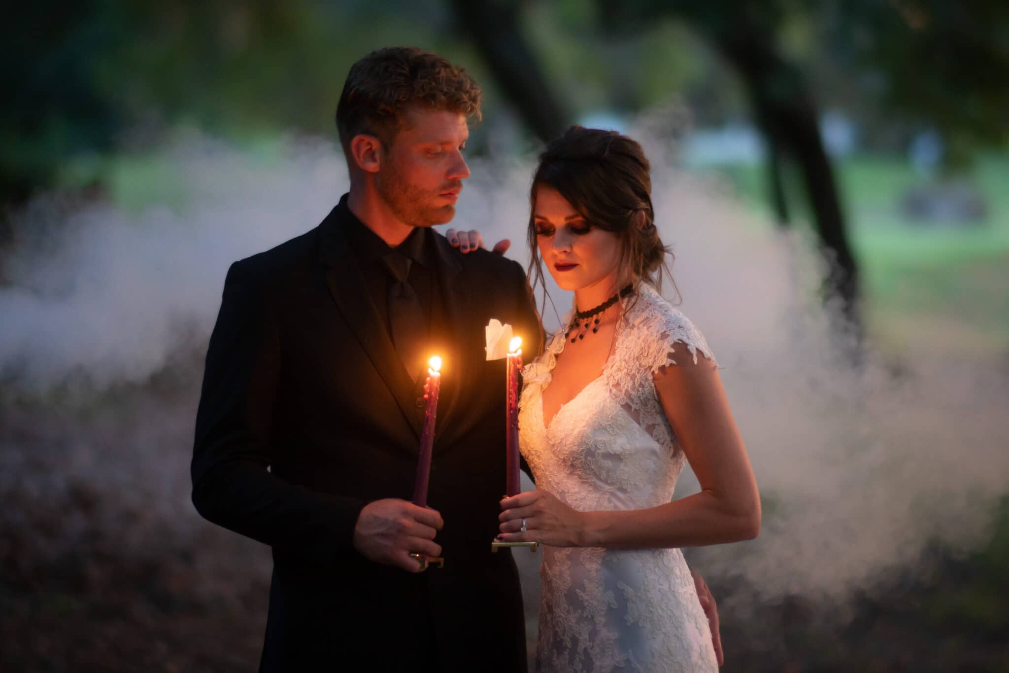 Gothic Victorian Wedding, bride & groom with candles in dark