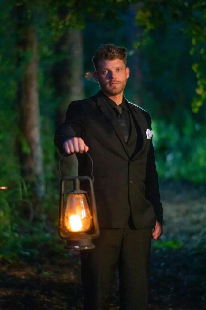 Gothic Victorian Wedding, groom outside in the dark with lantern