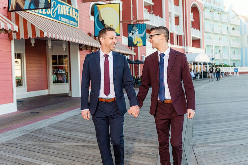 Just Marry! grooms walking down boardwalk holding hands