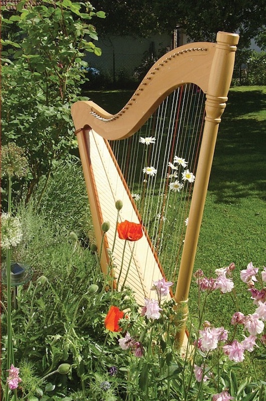 Music Remembrance harp nestled in garden