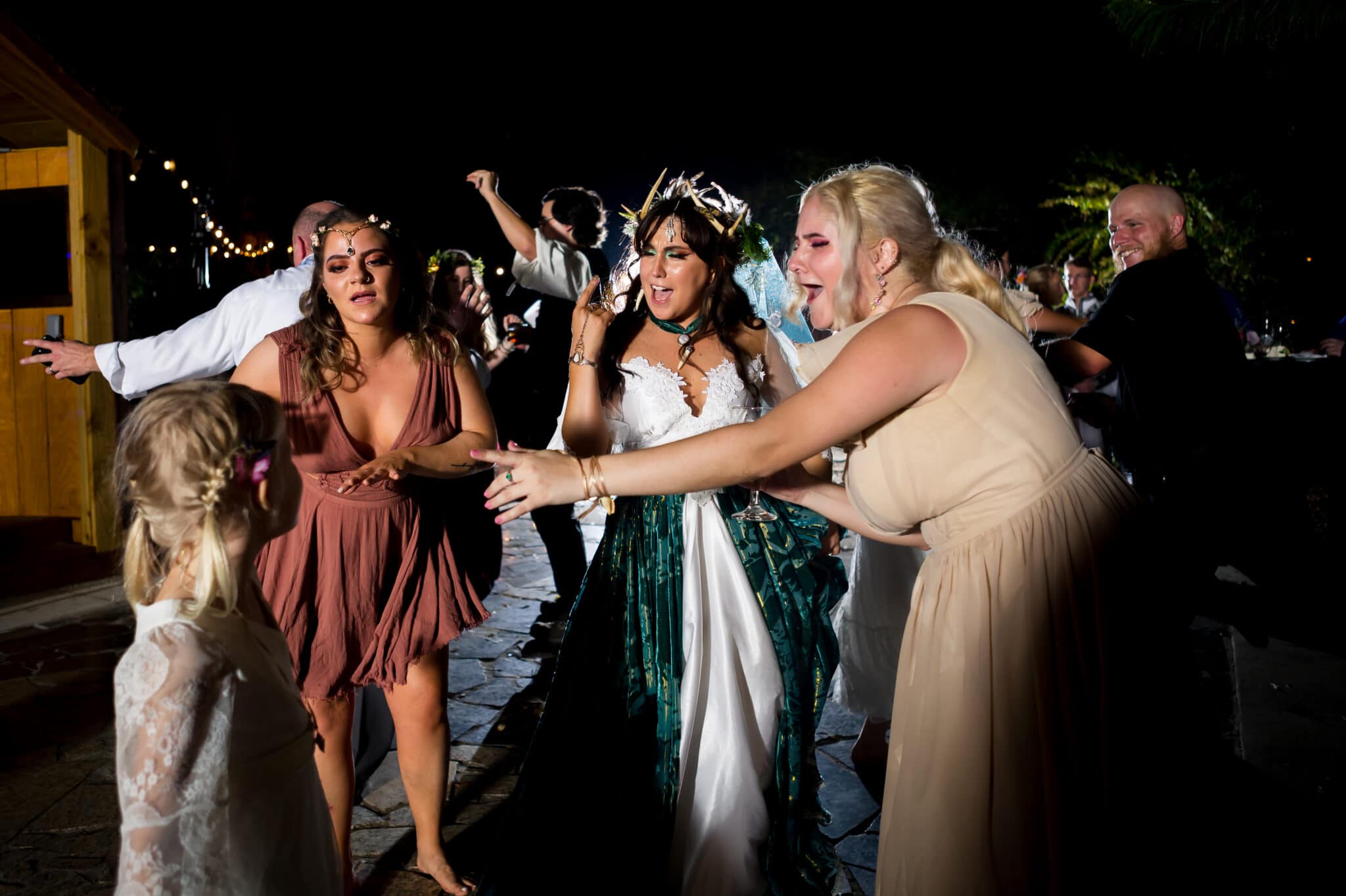 bride and guest dancing outside