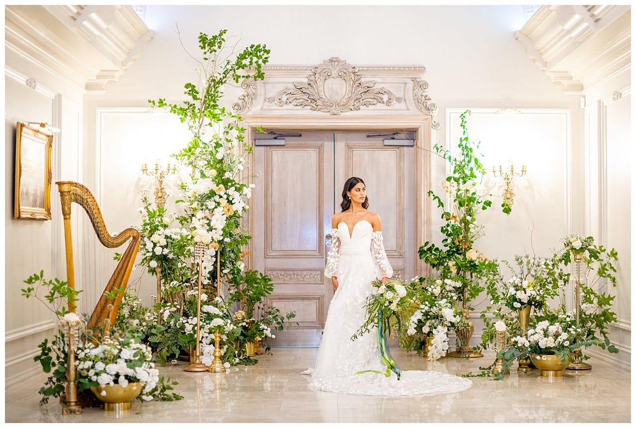 bride standing among plants and hard