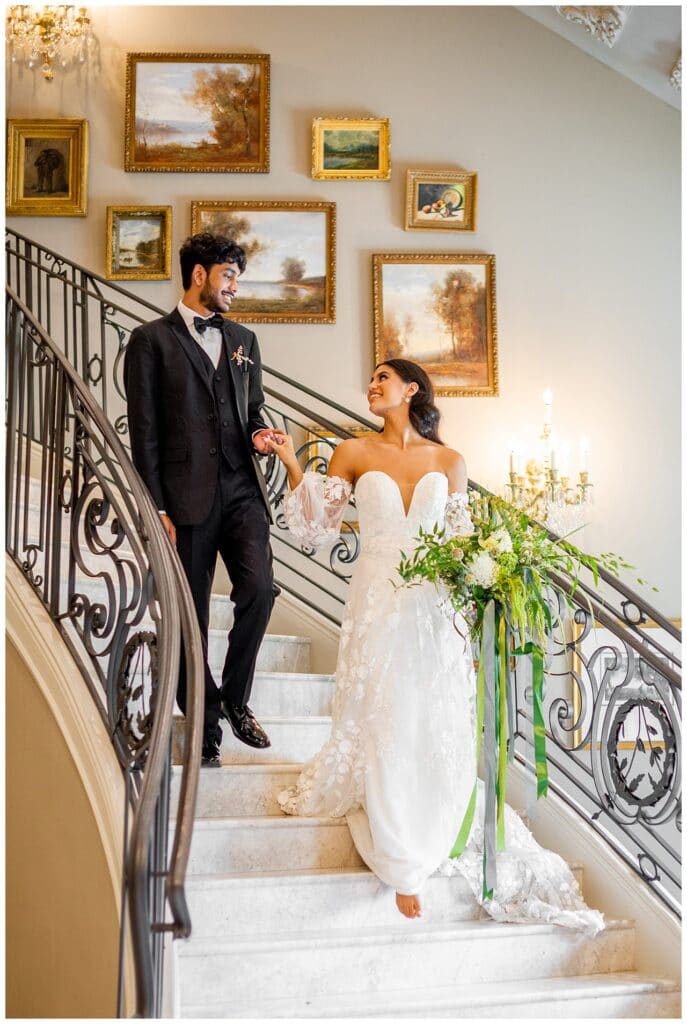 bride and groom on staircase