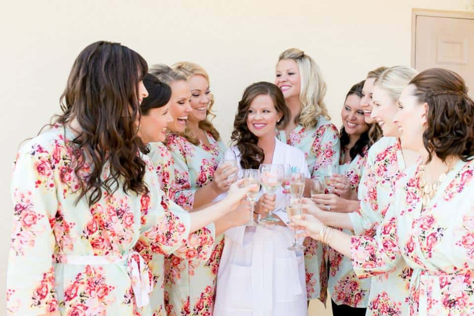 bride with wedding party in flower robes
