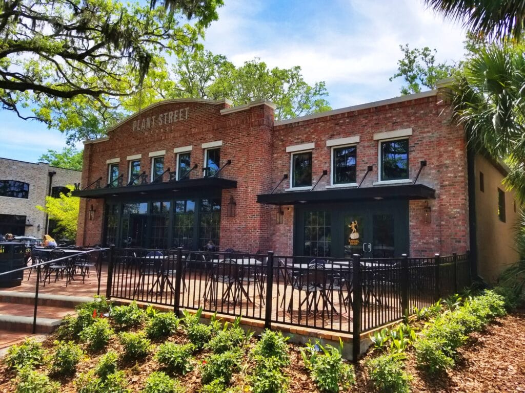 brick building with patio and black awnings - crooked can brewing co winter garden florida