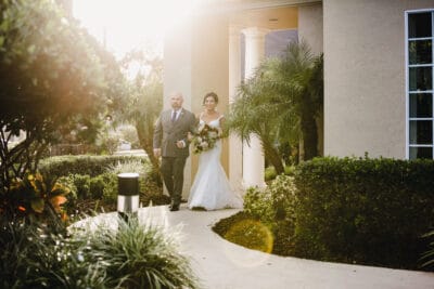 father escorting bride to her wedding ceremony