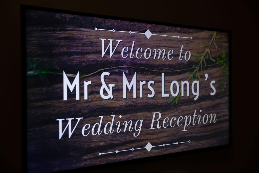welcome sign for wedding reception reading welcome to mr & mrs long's wedding reception