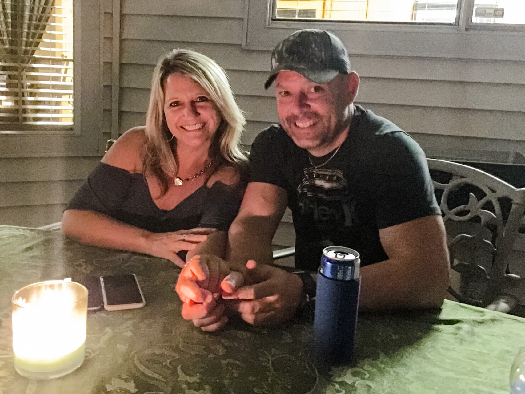 couple smiling outside at night after a christmas morning marriage proposal