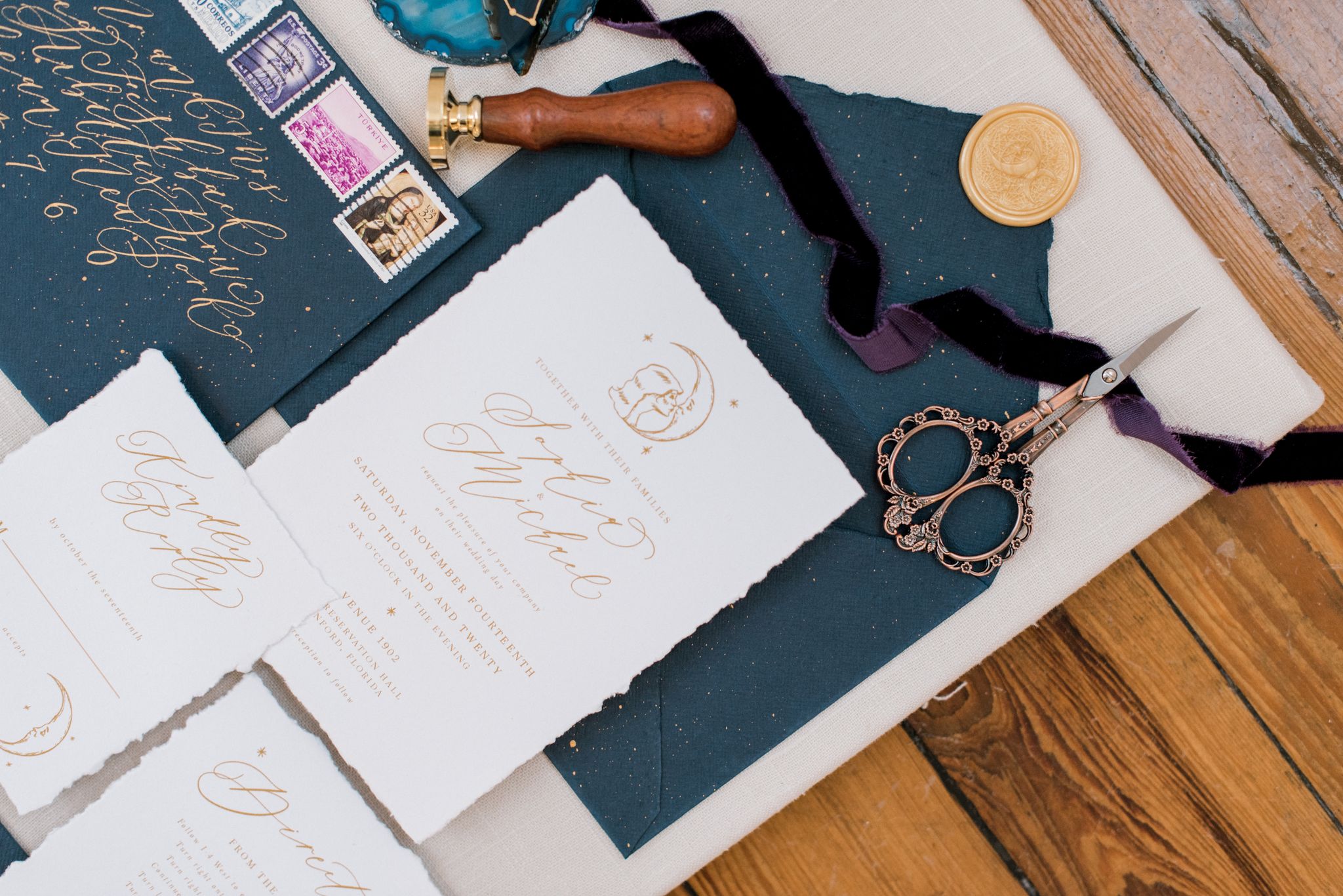 flat lay of wedding invitation and other personalized items from a calligrapher