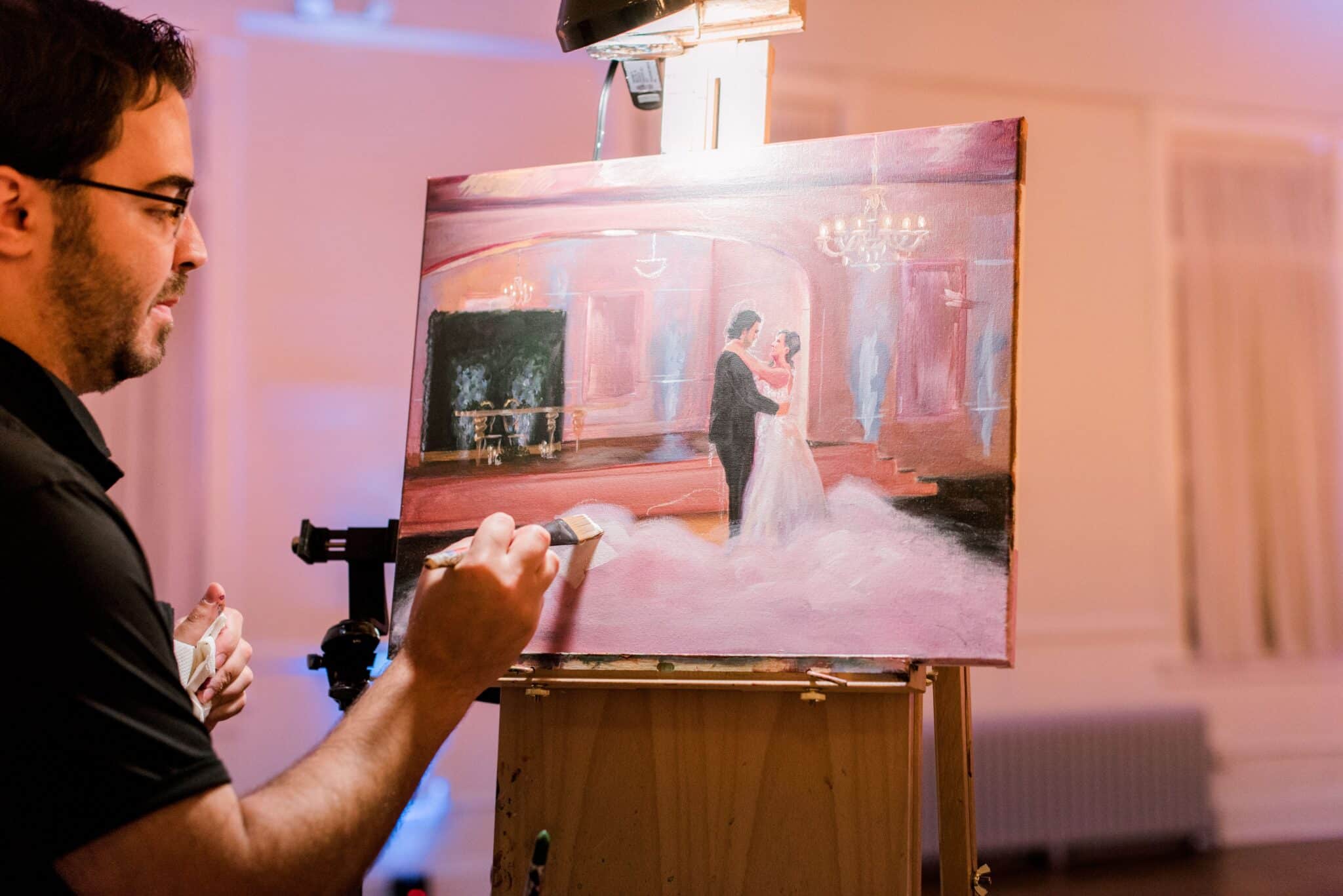 finished live painting from wedding with bride and groom in the painting dancing at reception surrounded by fog machine smoke
